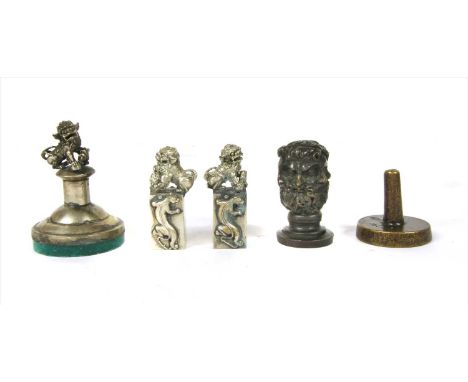 A 19th century French bronze desk seal, in the form of a group of conjoined classical style masks, alternately bearded, the m