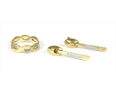 A pair of 18ct gold diamond earrings, with a line of brilliant cut diamonds, grain set to a tapered bar, to an openwork oval 