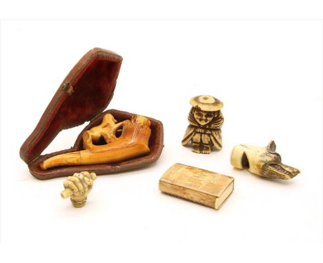 A Japanese bone netsuke figure, wearing a hat, a 19th century ivory carved figure, a horn snuff box, a whistle in the form of