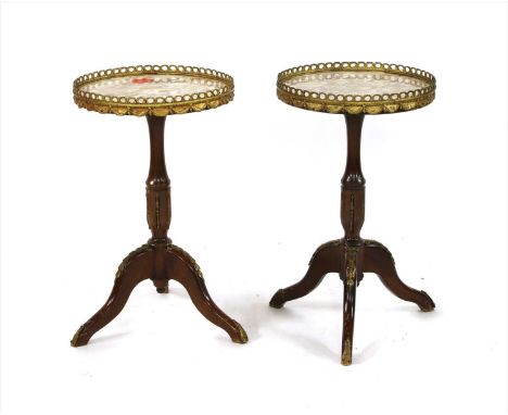 A pair of marble topped occasional tables , each with galleried top, and on tripod base, 34cm x 57cm