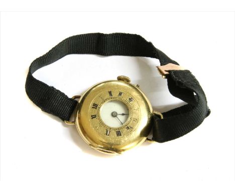An 18ct gold half hunter style pin set mechanical strap watch, chapter ring with blue enamel Roman numerals to outer case, wh