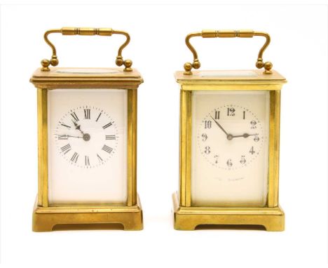A brass cased carriage clock, the enamel dial with Roman numerals, and one other similar carriage clock (2)