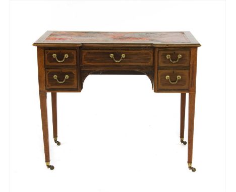 An Edwardian inlaid mahogany writing table, the leather lined top above an arrangement of drawers, on square tapering support