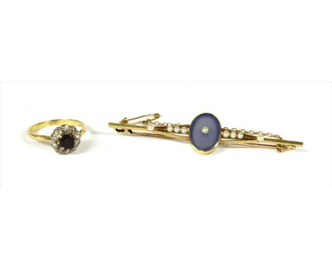 A gold dyed blue agate and seed pearl bar brooch, with an oval dyed blue agate tablet, rub set to the centre with an applied 