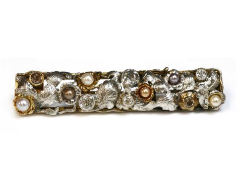 A Continental two colour gold diamond, fancy diamond and pearl foliate plaque brooch, c.1935-1945, an open rectangular plaque