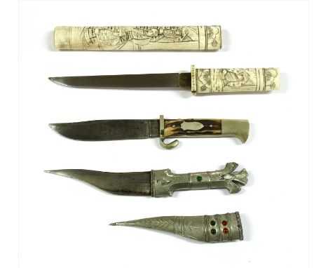 A Japanese Meiji period tanto, the carved bone handle and scabbard decorated with figures, together with a middle eastern dag