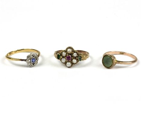 A pearl, emerald and ruby cluster ring, circa 1900, with engraved scroll shoulders and band, size O, a sapphire and diamond d