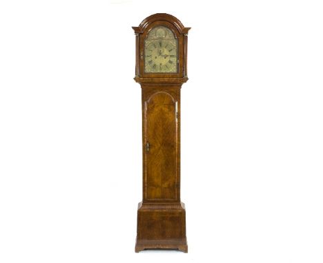 A George II walnut longcase clock, Robert Clark, London, the arch top case with fluted columns to the hood and quarter-veneer