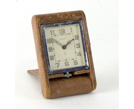 A folding bedside clock by Jaeger LeCoultre   Condition Report:  Lot 738 Ticks when wound. Unfortunately we cannot guarantee 
