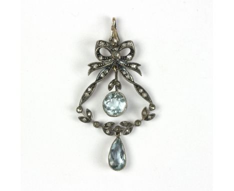 An Edwardian aquamarine and diamond pendant of wreath form beneath a ribbon-tie and with two aquamarine drops   Condition Rep