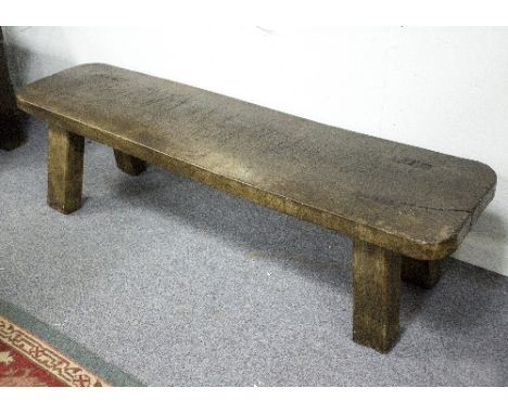 A chestnut pig bench, on tapered legs, 147.5cm wide