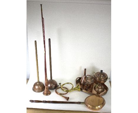 A copper samovar, a small brass watering can, a funnel, two copper clothes plungers, a warming pan, a tray and two hunting ho