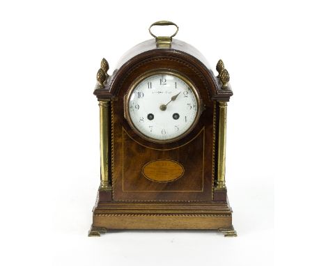 An Edwardian mahogany eight-day mantel clock with enamel dial, 30cm high