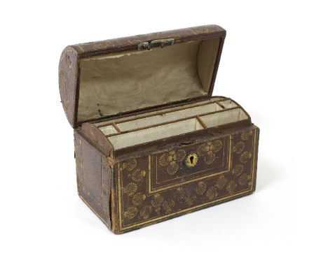 A tooled leather stationery box with domed cover decorated scallop shells, 21.5cm wide 