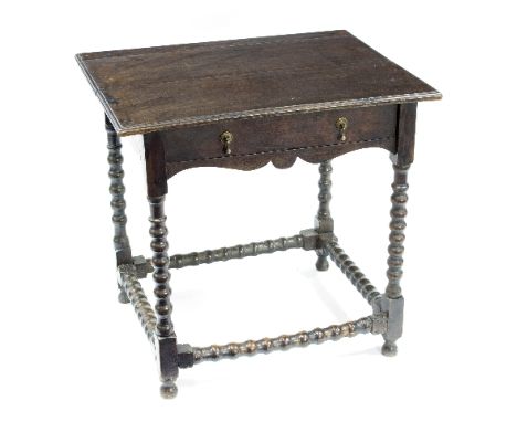 An 18th Century and later side table with single drawer on bobbin turned legs and support stretcher, 71cm wide