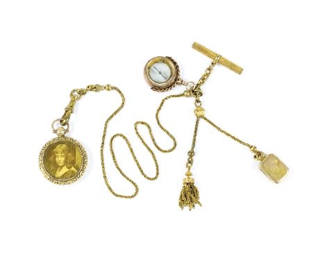 A 9ct gold framed locket with glazed panel to each side, a 9ct gold framed compass and a small unmarked yellow metal box, all