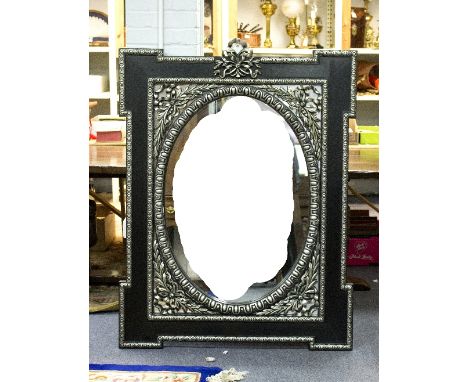 A modern wall mirror, the oval plate beneath a ribbon-tie with egg and dart borders, 144cm high
