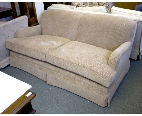 A modern two-seater sofa   Condition Report:  Sofa has turned legs below a divan base. Cushions have some staining. Width 182