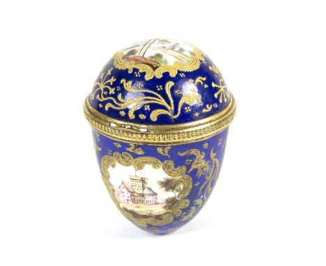A South Staffordshire enamel bonbonniere of egg shape, decorated reserves of ruins and buildings within gilt scroll borders t