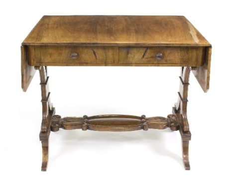 A walnut sofa type dressing table, with pierced end standards and flat platform stretchers, 141cm wide