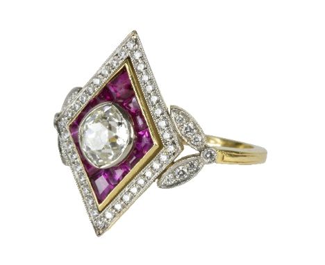 An Art Deco style diamond and ruby ring, the central mixed cut diamond approximately 1ct, in a ruby and diamond geometric set