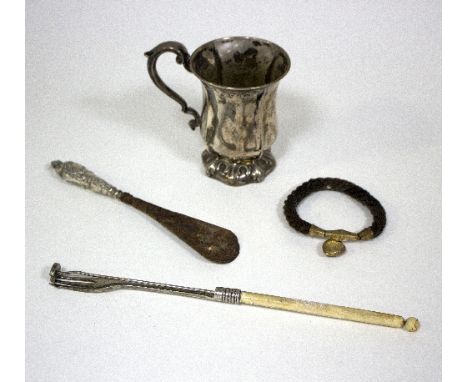 A silver mug, Henry Wilkinson & Co, Sheffield, of lobed form on a leaf moulded foot, a Victorian woven bracelet with heart-sh
