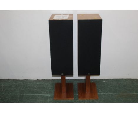 A pair of Monitor Audio R352 speakers, serial No. 12107 in teak pedestal cabinets, 99 cm high  and sold with original instruc