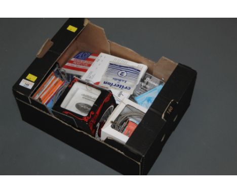 A box of mixed guitar strings including Stagg