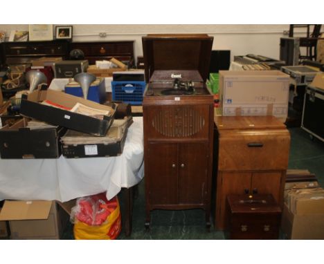 A Brunswick oak cased gramophone model No. 312324, the cabinet with lifting cover, 120 cm high (turntable working and playing