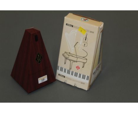 A Wittner metronome, as new.  Height 22 cm, boxed.