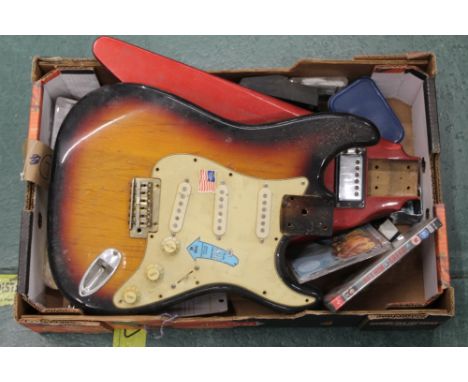 A Fender S-1 electric guitar body, one other electric guitar body and mixed guitar items. CONDITION REPORT: Both guitar bodie