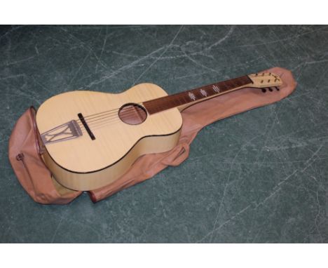 A 1950's Stella Blonde tiger stripe parlour size acoustic guitar, 91 cm long (slightly loose to joints), sold with a soft car