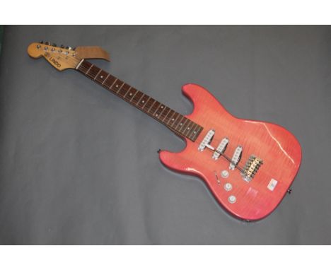 A Lindo left handed electric guitar with pale pink lacquered body, 99 cm long. CONDITION REPORT: This guitar has very slight 