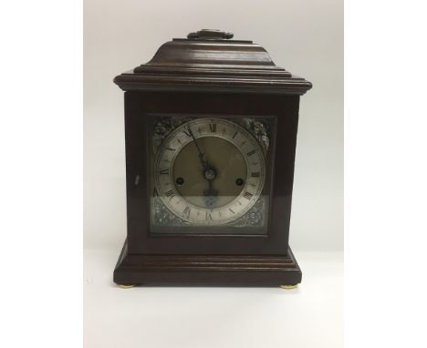 A German eight day musical clock, approx height 26cm.