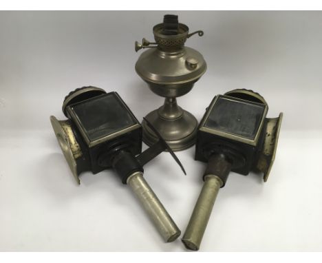 A pair of vintage coach lamps plus an old oil lamp.