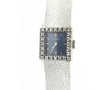 A ladies 18ct white gold Girard-Perregaux manual wind wristwatch with the blue dial presenting baton numeral indicators, the 