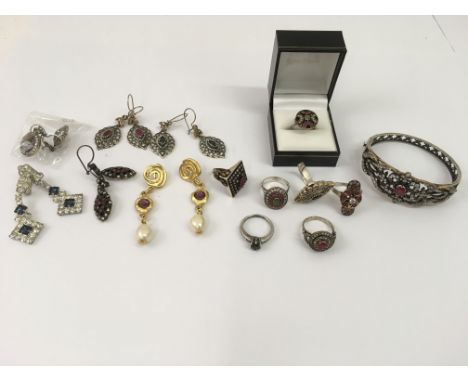 A collection of diamanté dress rings, earrings and bangle including some silver