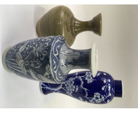 Three Chinese vases comprising two blue and white and. Guan pottery example.Approx 26and 32cm, largest vase a/f