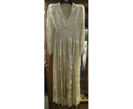 A vintage 1940's cream satin type wedding dress, approx size 8/10