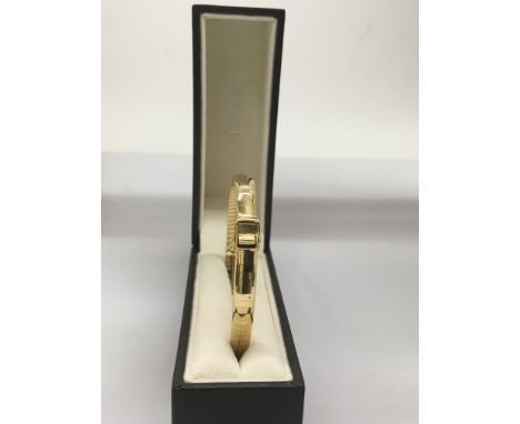 An 18ct gold buckle bangle on expanding strap, in fitted Stern Jeweller's box.Approx 21.5g