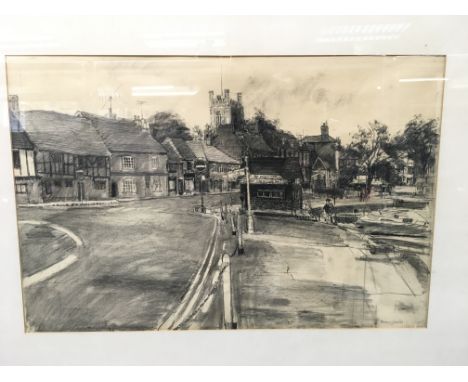 A large framed charcoal sketch by Thomas J Coates depicting a town scene. Frame measures approx 110cm x 84.5cm.