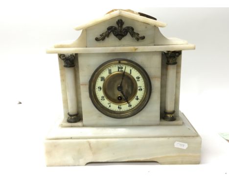 A late Victorian Onyx mantel clock fitted with a French movement. With key and pendulum.