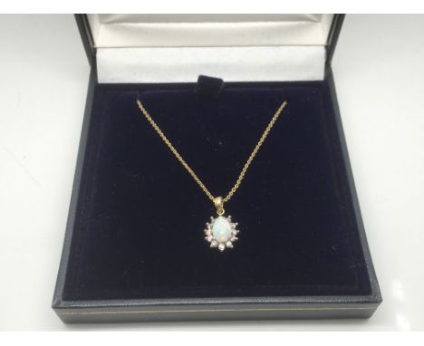 A 9ct gold necklace with an opal pendant, approx 1.9g.