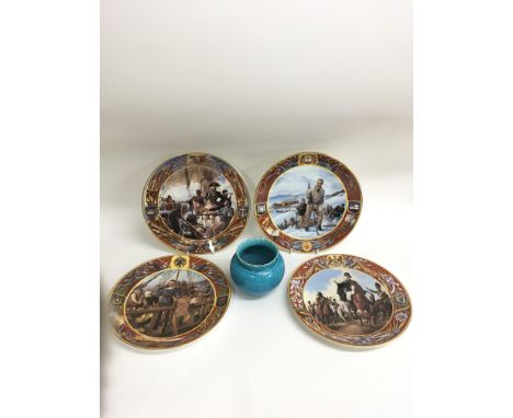 A small turquoise glaze Burmantofts planter and four Royal Doulton British Heroes plates, one signed by the artist
