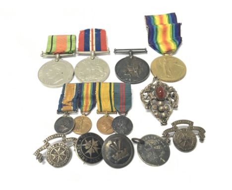 Two I World War medals awarded to 156543 Gnr R Leins. R.A with four miniature medals two II world war medals other badges and