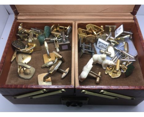 Approx twenty pairs of cuff links in a vintage jewellery box.