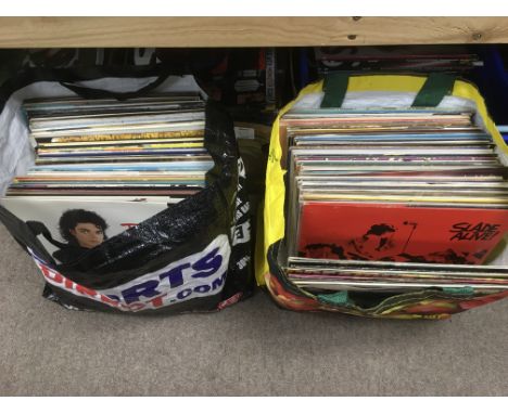 A collection of LPs and 12 inch singles by various artists including Slade, Michael Jackson and others.