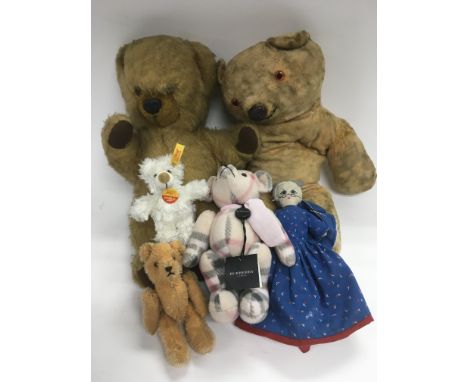 Four vintage teddy bears including Burberry and Steiff examples plus a topsy turvey doll.