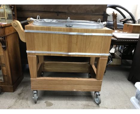 A vintage beef trolley on wheels with a folding lid. Approximately 98cm tall, 100cm long and 53cm wide.