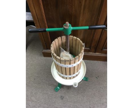 A vintage wood and metal fruit press.Approx 64cm